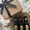 3 bottles of olive oil in a gift kraft box and ribbon